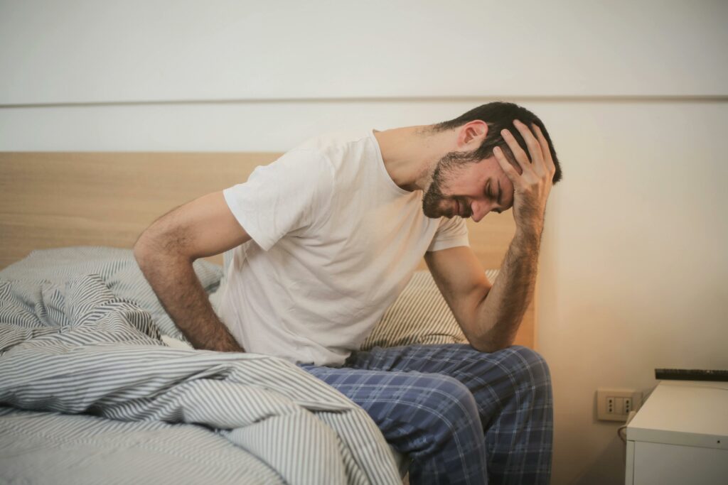 Medical professional evaluating a patient for headache and dizziness and abdominal pain treatment